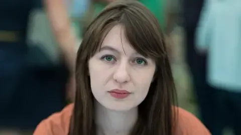 Sally Rooney claims she cannot travel to the UK due to arrest fears